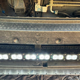 grey subaru outback with white led light bar off roading