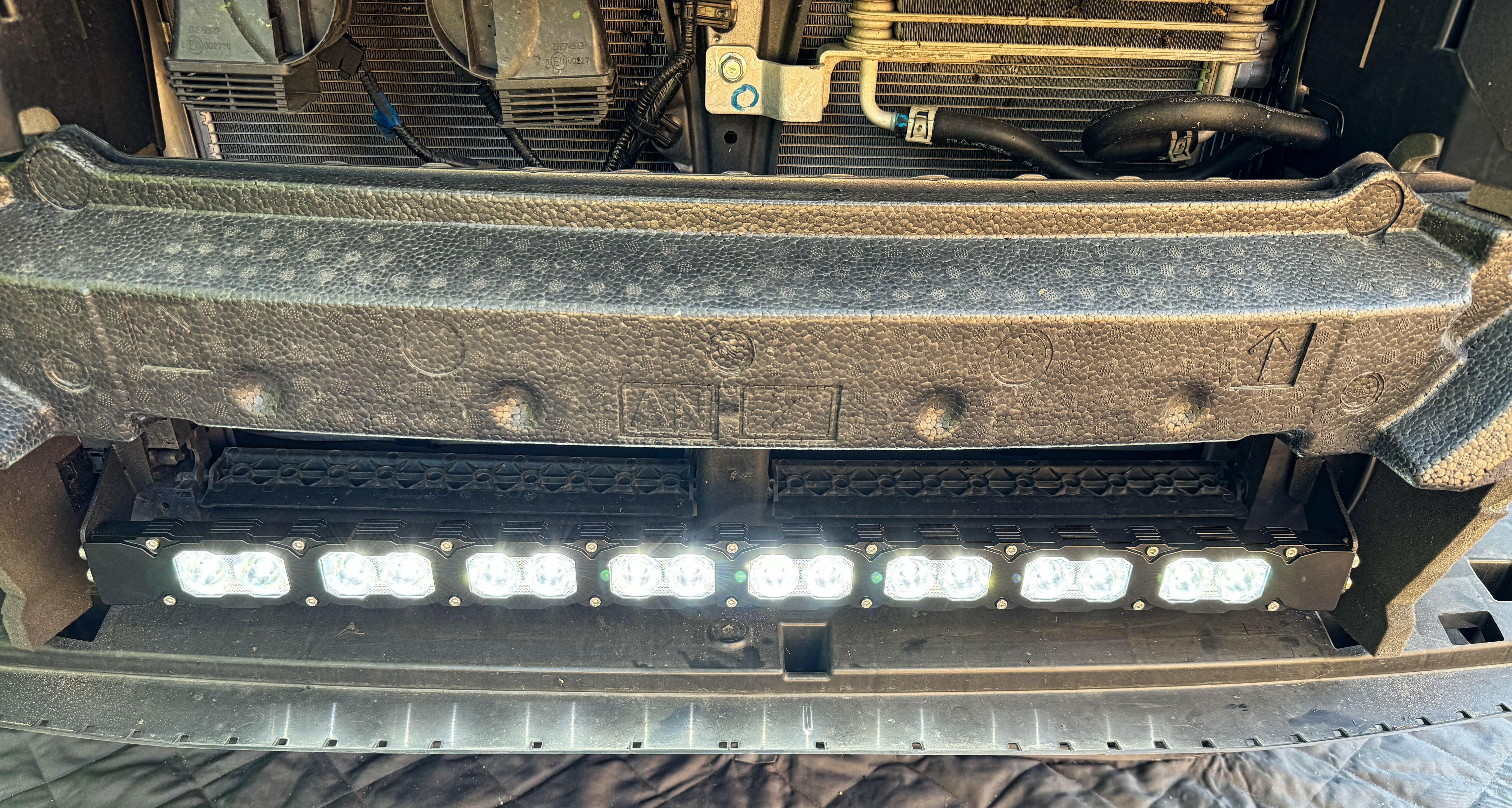 grey subaru outback with white led light bar off roading