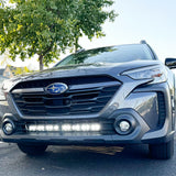 grey subaru outback with white led light bar off roading