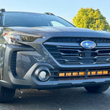 grey subaru outback with amber daytime running lights led light bar off roading