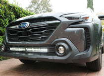 grey subaru outback with white led light bar off roading