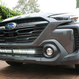 grey subaru outback with white led light bar off roading