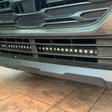grey subaru outback with led light bar off roading
