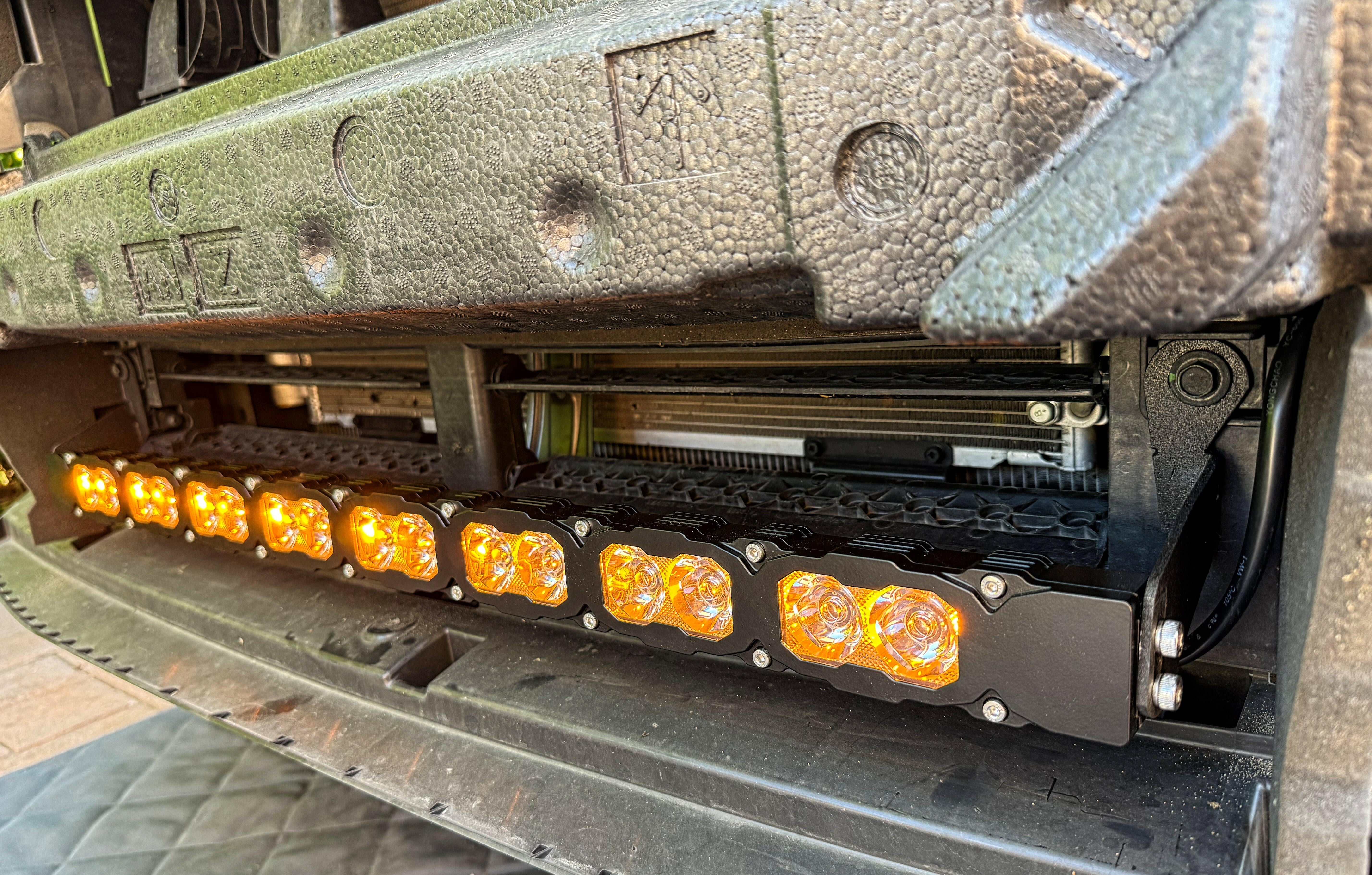 subaru outback behind grille with amber daytime running lights led light bar off roading