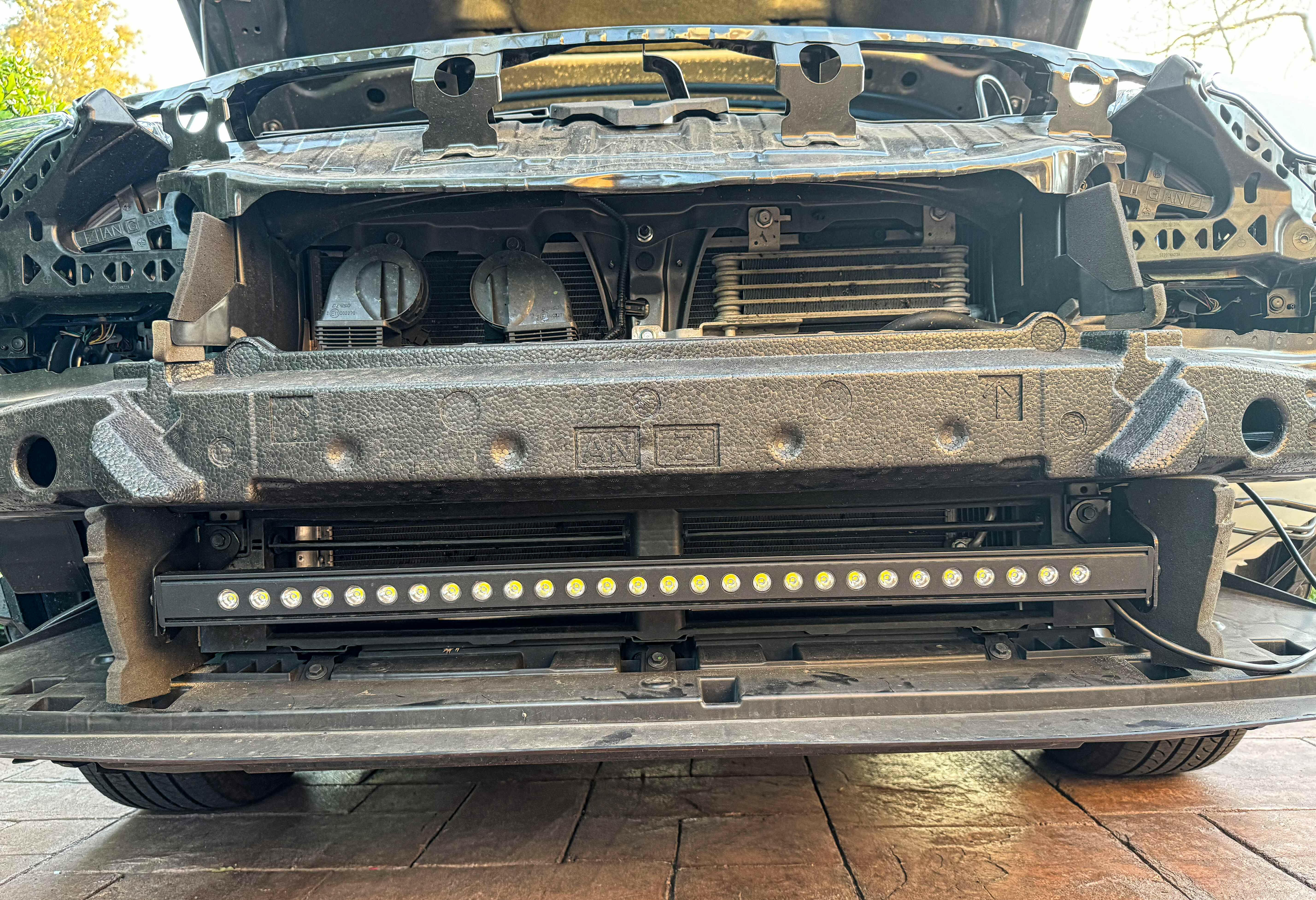 subaru outback behind grille with led light bar off roading