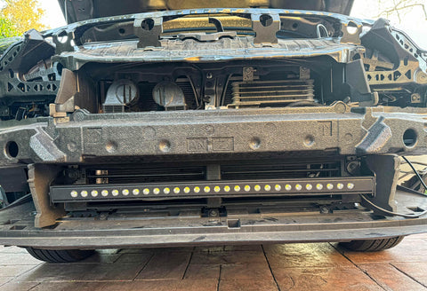 subaru outback behind grille with led light bar off roading