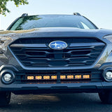 grey subaru outback with amber daytime running lights led light bar off roading