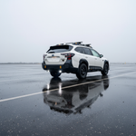 Subaru Outback reverse light kit on 2020-2024 Outback showing bright LED reverse pods in rainy parking lot