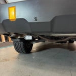 Subaru Outback reverse light kit installed under rear bumper showing dual LED pod upgrade for 2020-2024 Outback models