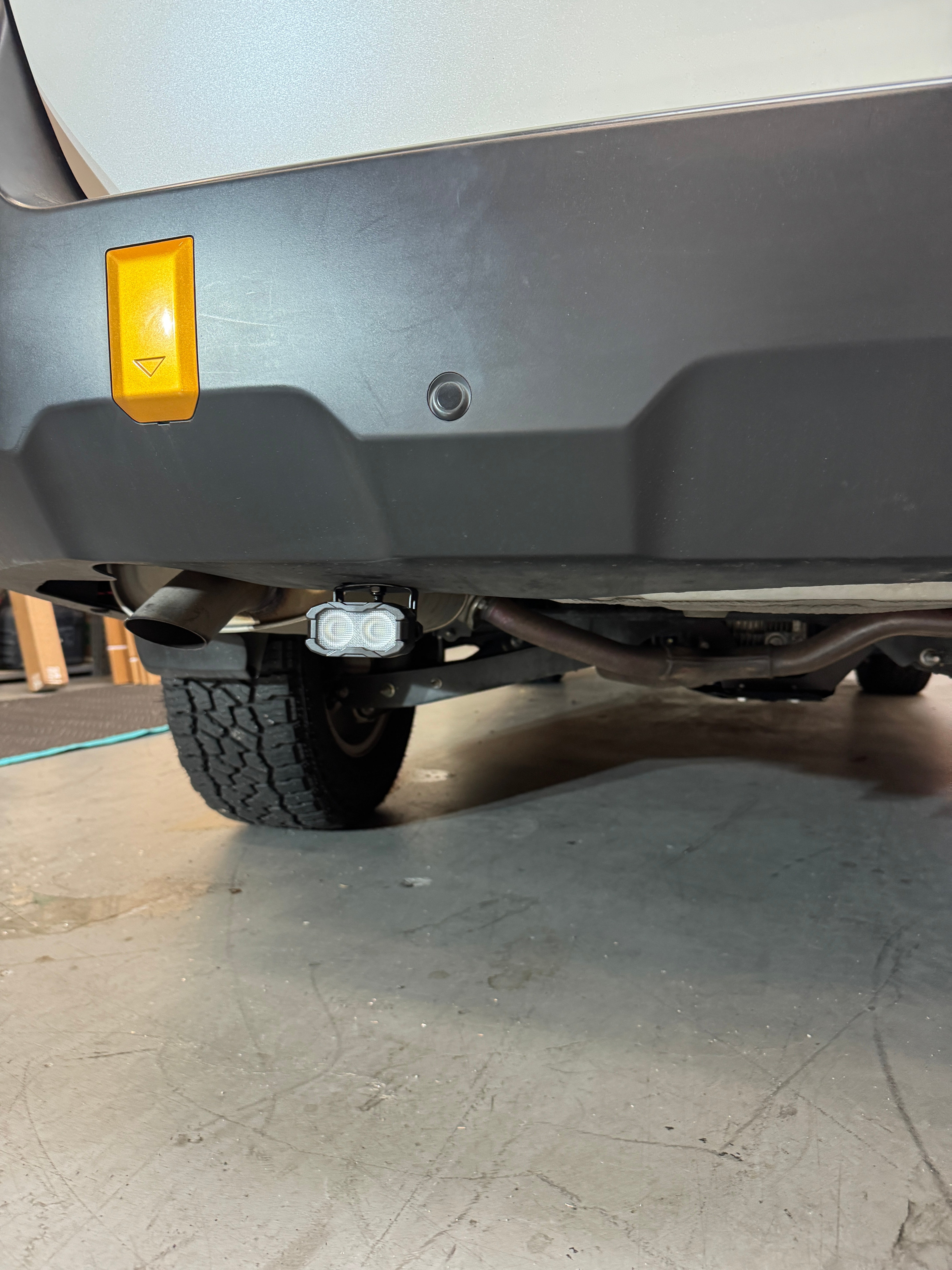 Subaru Outback reverse light kit installed under rear bumper showing dual LED pod upgrade for 2020-2024 Outback models