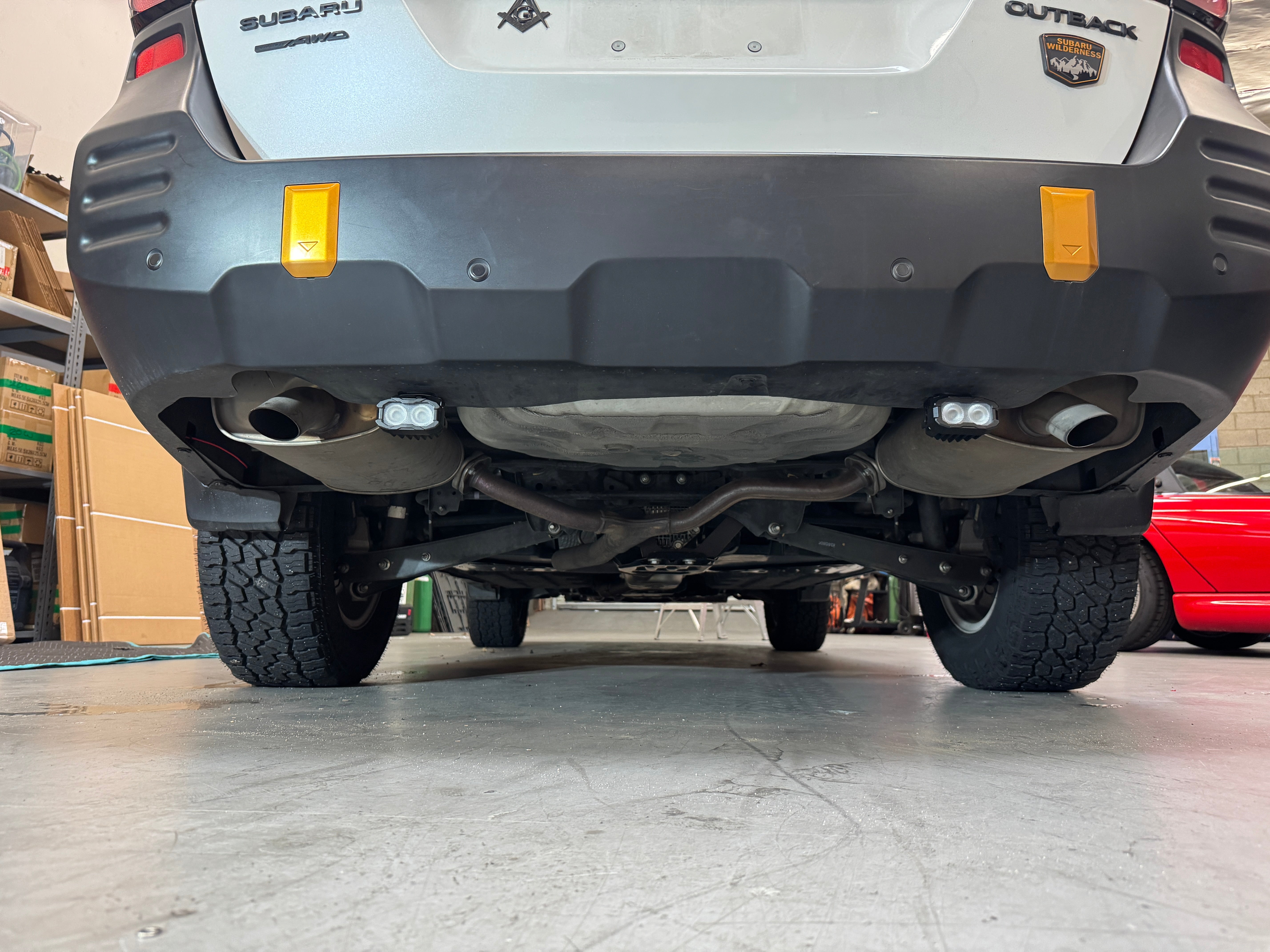 Subaru Outback reverse light kit installed on 2020-2024 Outback rear bumper showing bright LED reverse pods