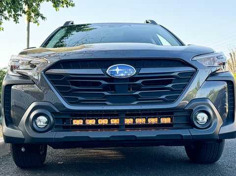 grey subaru outback with amber daytime running lights led light bar off roading