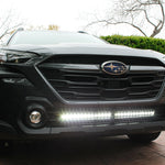 grey subaru outback with led light bar off roading