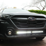 grey subaru outback with led light bar off roading