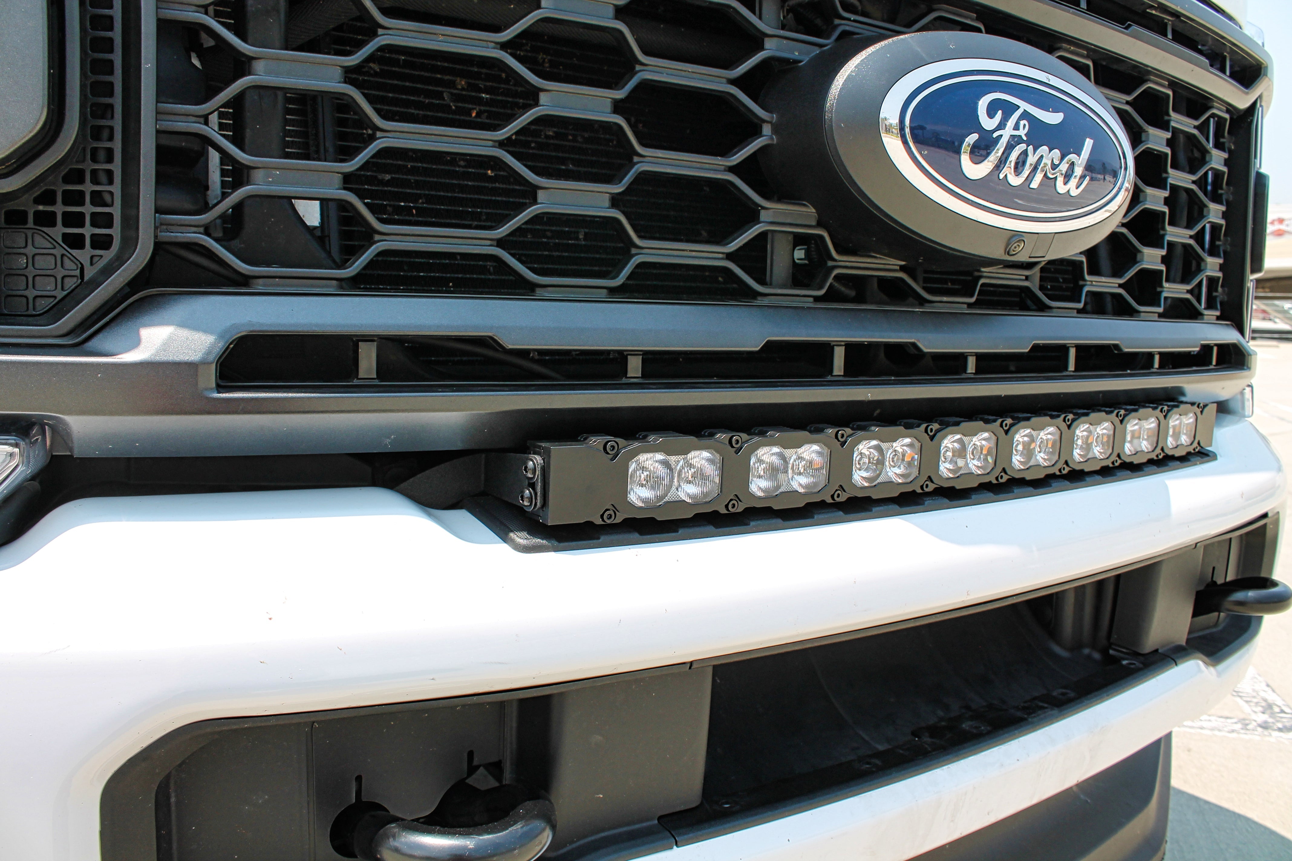 white 2023 2024 Ford F250/350/450 Superduty Single 30in curved LED Light Bar sit on top of bumper, sleek design