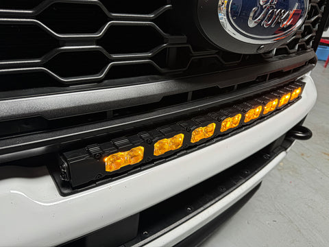 curved 40in LED light bar installed on top of 2023 2024 ford superduty with amber day time running lights