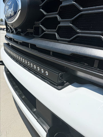 side view of white 2023 2024 Ford F250/350/450 Superduty Single 30in curved Light Bar installed on top of bumper