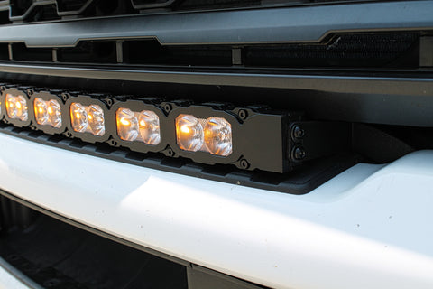 amber day time running lights on the curved LED light bar installed on top of bumper of ford superduty 2023