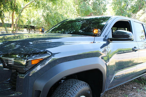 black 2024 toyota tacoma with ditch lights, hood mount kit, pillar lights