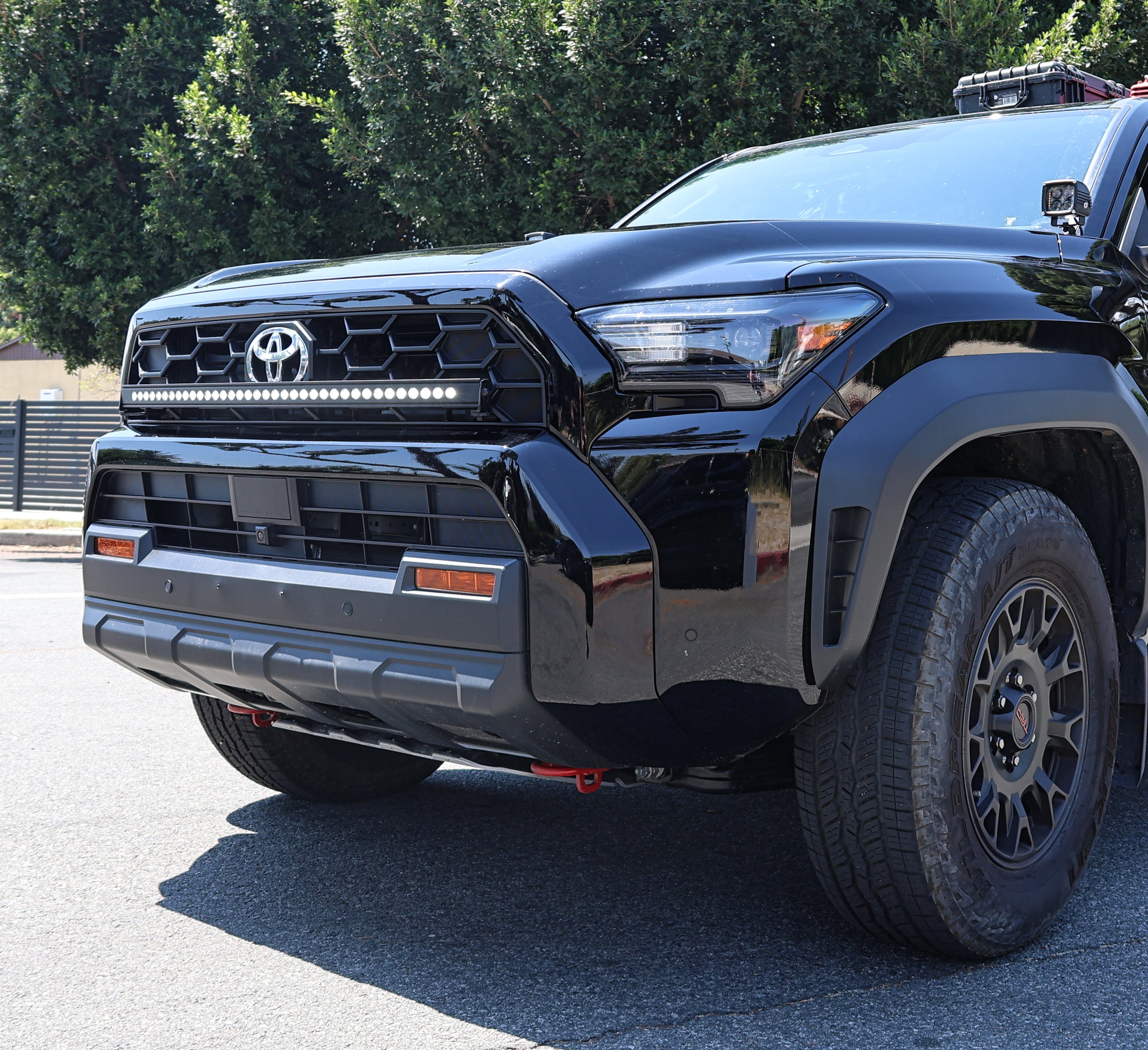 4Runner Light Bar slim curved 40in LED mounted in front grille on 2025 Toyota 4Runner TRD Off-Road style black SUV