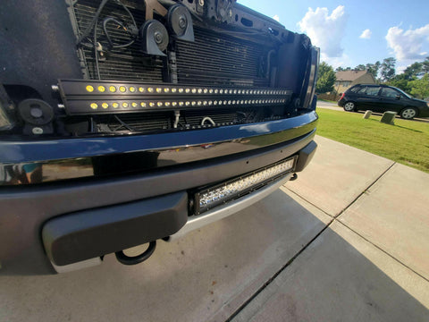 2010-2014 Ford Raptor Gen 1 Light Bars installed behind grille and bumper, dual LED 40s front lighting upgrade