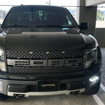 2010-2014 Ford Raptor Gen 1 fog light kit installed in front bumper showing dual function fog pods with white and amber DRL