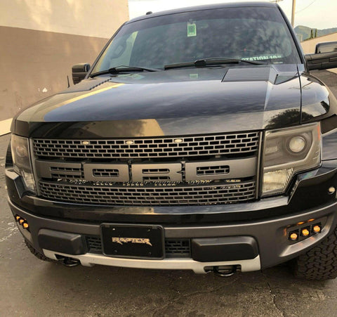 Ford Raptor Gen 1 fog light kit installed on 2010-2014 Ford Raptor front bumper with dual function amber and white fog lights