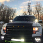 2010-2014 Ford Raptor Gen 1 Dual Function Fog Light Kit installed with bright Ford Raptor Gen 1 fog light pods at dusk