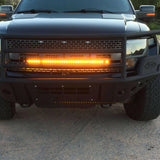 2010-2014 black Ford Raptor Gen 1 LightBar single 40in amber LED light bar mounted in front bumper grille