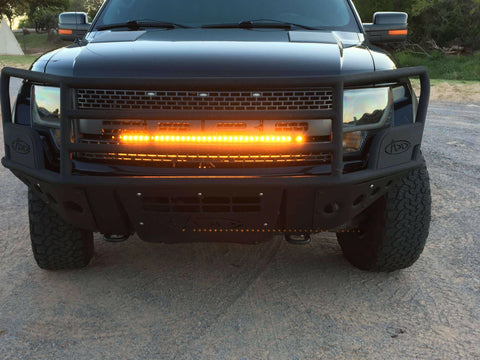 2010-2014 black Ford Raptor Gen 1 LightBar single 40in amber LED light bar mounted in front bumper grille