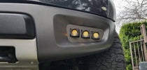 2010-2014 Ford Raptor Gen 1 Dual Function Fog Light Kit installed in bumper, triple Ford Raptor Gen 1 fog light pods