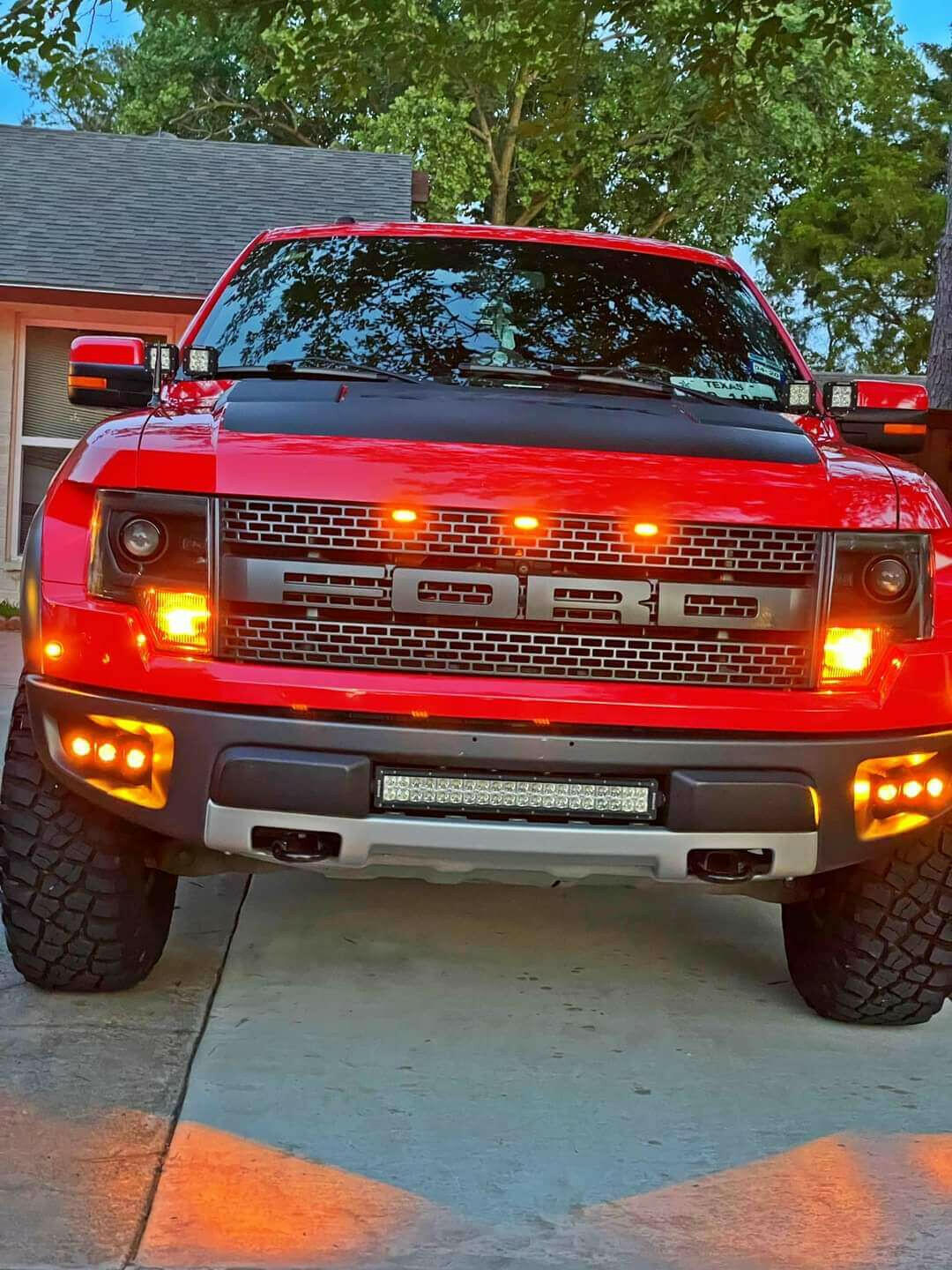 2010-2014 Ford Raptor Gen 1 with amber DRL dual function Ford Raptor Gen 1 fog light kit installed in factory front bumper