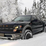 2010-2014 Ford Raptor Gen 1 with upgraded Ford Raptor Gen 1 fog light kit driving in snowy forest
