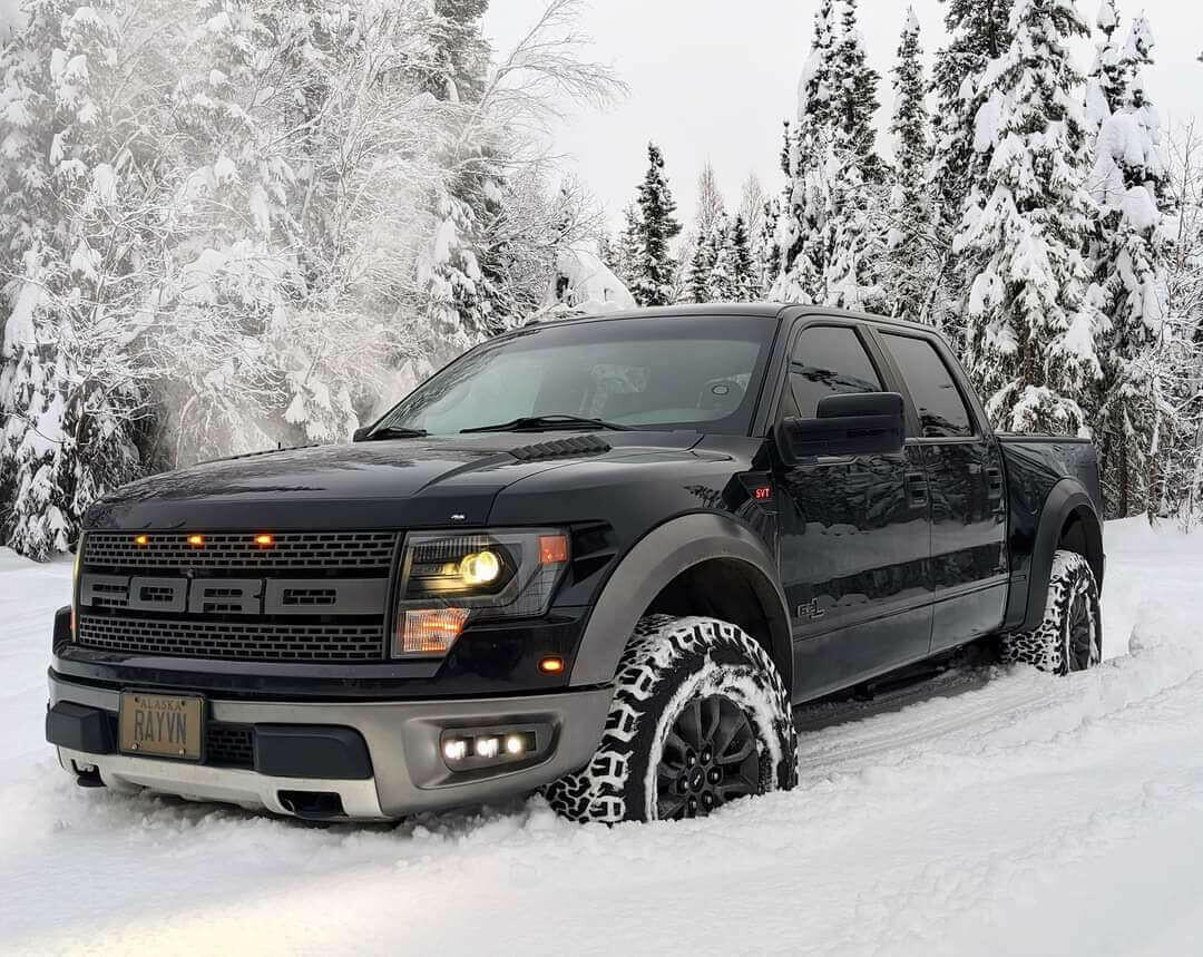 2010-2014 Ford Raptor Gen 1 with upgraded Ford Raptor Gen 1 fog light kit driving in snowy forest