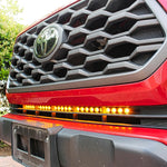 2020 2021 2022 2023 upclose red Toyota Tacoma with one amber 30in Light Bar