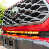 2020 2021 2022 2023 upclose red Toyota Tacoma with one amber 30in Light Bar