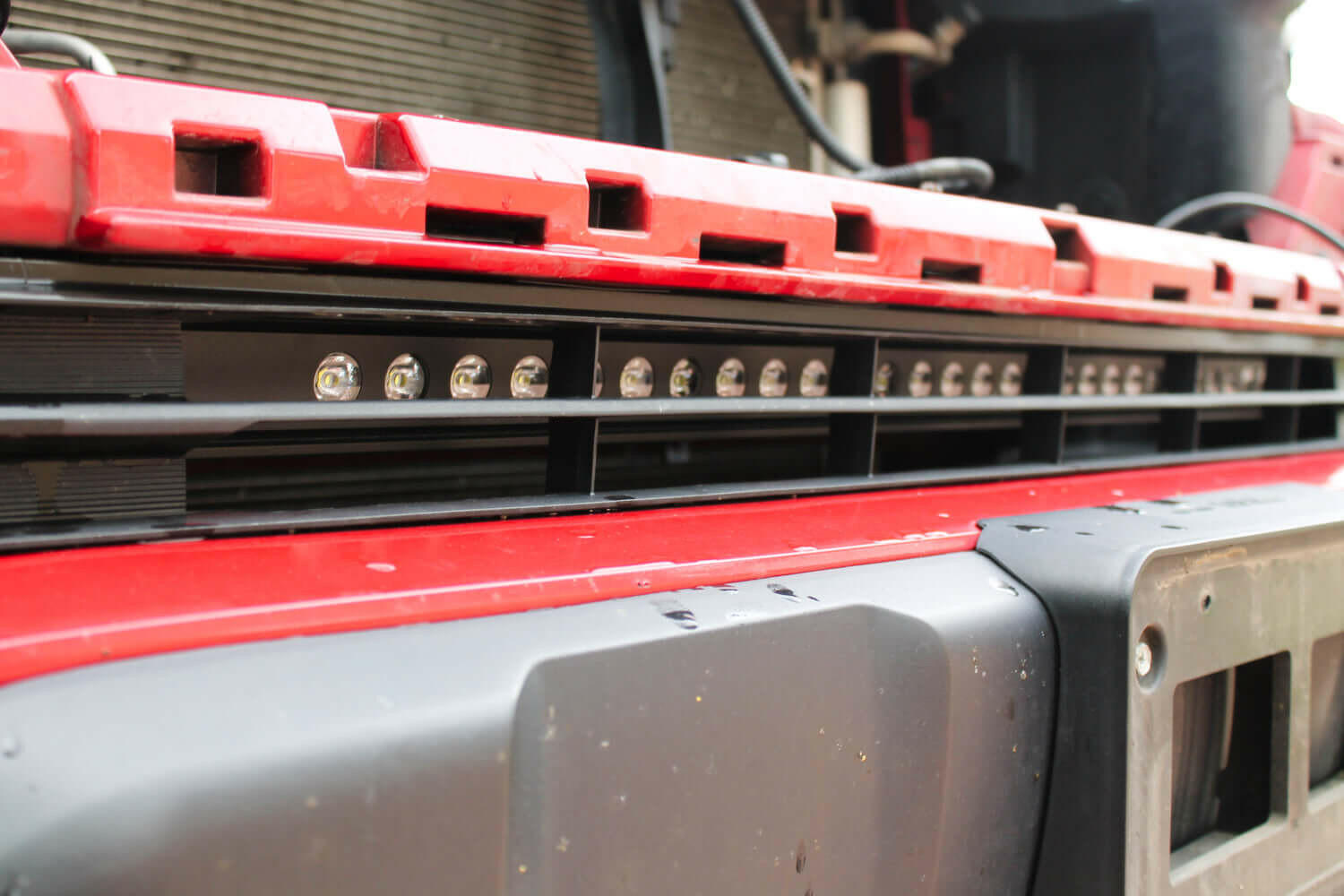 2020 2021 2022 2023 upclose red Toyota Tacoma with one 30in Light Bar