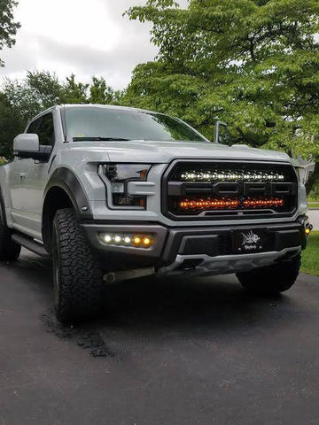 white ford raptor generation 2 with 2 40in behind the grille light bars color white and amber 
