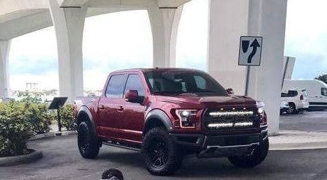 red ford raptor generation 2 under the bridge with 2 40in behind the grille light bars color white