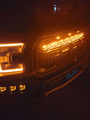 ford raptor generation 2 with 1 amber 40in behind the grille light bar