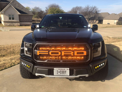 gray ford raptor generation 2 with 2 amber 40in behind the grille light bars