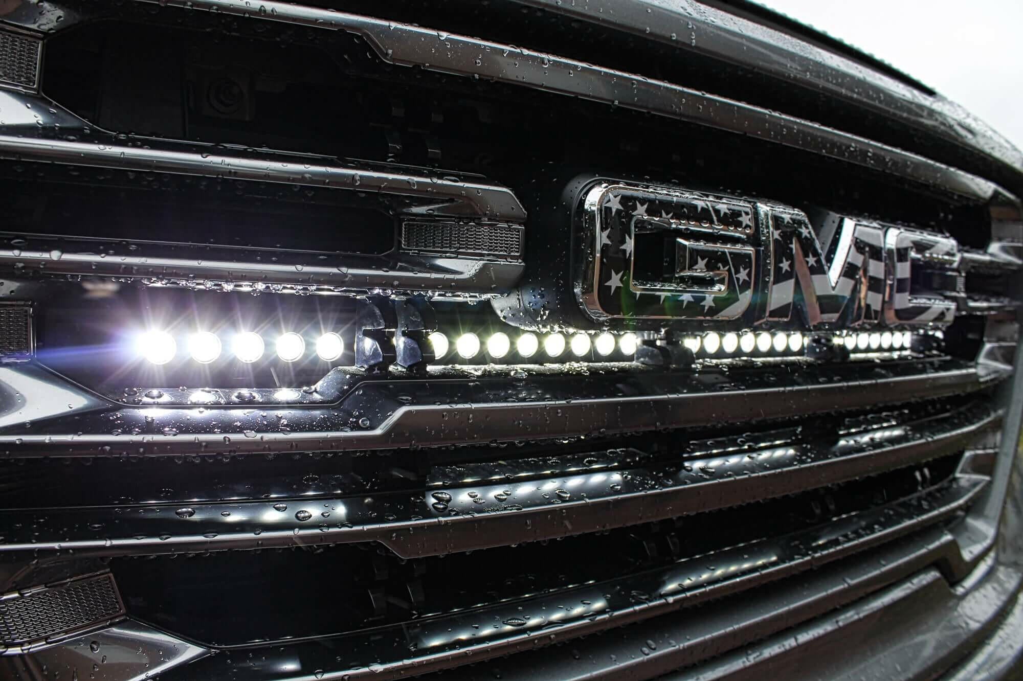 2019 2020 2021 2022 2023 gray GMC Sierra 1500 with one white 40in Light Bar behind the grille