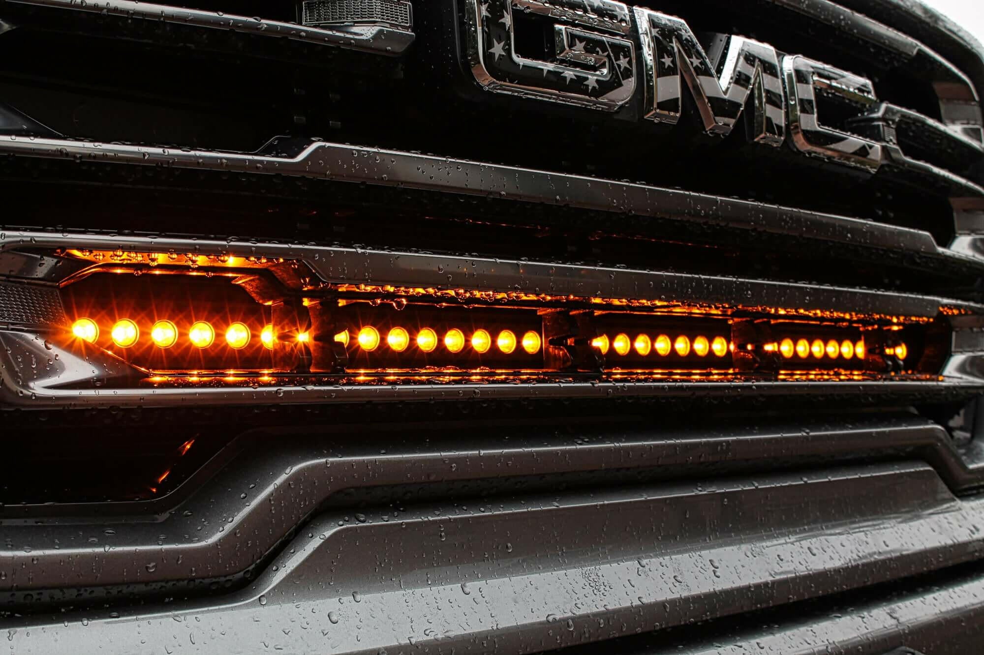 2019 2020 2021 2022 2023 gray GMC Sierra 1500 with one amber 40in Light Bar behind the grille