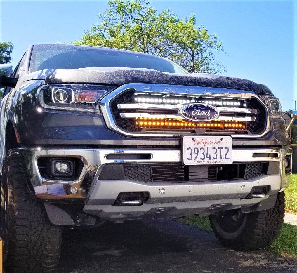 blue 2019 2020 2021 2022 ford ranger with 2 30in light bars behind the grille color white and amber