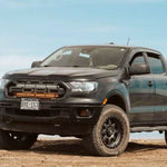 black 2019 2020 2021 2022 ford ranger off roading with 2 30in light bars behind the grille color