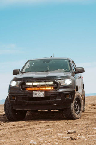 black 2019 2020 2021 2022 ford ranger off roading with 2 30in light bars behind the grille color