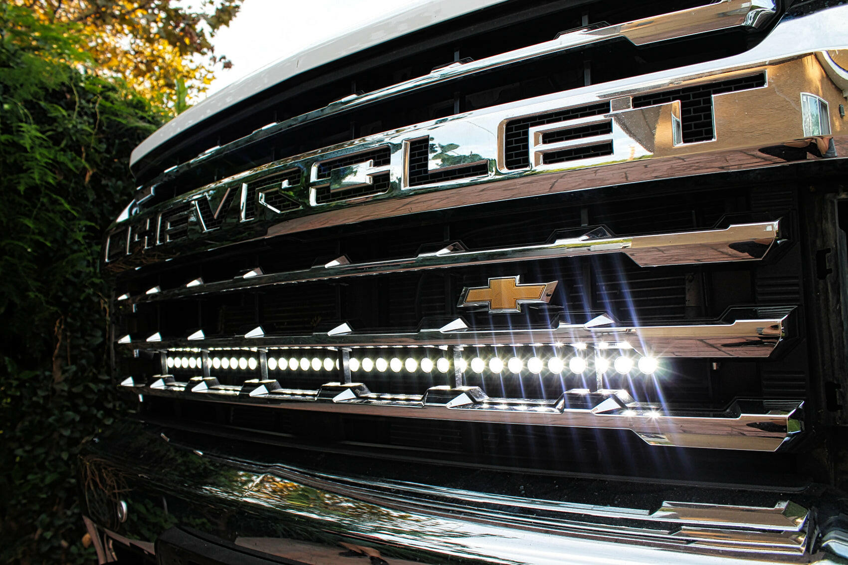 2020 2021 2022 2023 white Chevrolet Silverado 2500/3500HD one white 40in Light Bar behind the grille by M&R Automotive