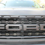 u[ close view of 2021 22021 2022 2023 ford raptor generation 3 grille with off roading light bars behind