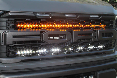 u[ close view of 2021 22021 2022 2023 ford raptor generation 3 grille with off roading light bars behind
