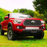 2016 2017 2018 2019 red Toyota Tacoma with one white 30in Light Bar
